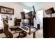 A modern home office with desk, ergonomic chair, and impressive multi-monitor setup for efficient work at 6647 Lynx Cv, Lone Tree, CO 80124