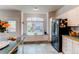 Bright kitchen with a window seat, abundant cabinets, and stainless steel appliances at 6647 Lynx Cv, Lone Tree, CO 80124