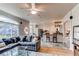 Open-concept living area with hardwood floors, large windows, and seamless flow to the kitchen at 6647 Lynx Cv, Lone Tree, CO 80124