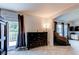 Bright room with a balcony and large windows, carpeted flooring, and comfortable furniture at 6647 Lynx Cv, Lone Tree, CO 80124