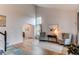 Bright living room with vaulted ceilings, wood floors, and views to the dining area and staircase at 6647 Lynx Cv, Lone Tree, CO 80124