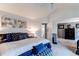 Spacious main bedroom featuring a bed and an additional area with dressers and private bath at 6647 Lynx Cv, Lone Tree, CO 80124