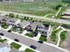 Beautiful aerial view of the home featuring professional landscaping, solar panels, and an open space at 6193 Saddle Bow Ave, Parker, CO 80134