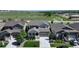 Aerial view of a well maintained house with a lawn in a neighborhood near fields and a walking path at 6193 Saddle Bow Ave, Parker, CO 80134