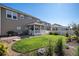 Well-manicured backyard features a covered porch, patio area and mature landscaping creating a private oasis at 6193 Saddle Bow Ave, Parker, CO 80134