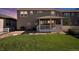 Inviting backyard with a covered porch, patio and a well-maintained lawn perfect for outdoor activities at 6193 Saddle Bow Ave, Parker, CO 80134