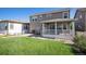 Spacious backyard features a covered porch, patio area and lush green lawn for relaxation and play at 6193 Saddle Bow Ave, Parker, CO 80134