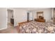 Comfortable bedroom with ensuite bathroom and wooden furniture at 6193 Saddle Bow Ave, Parker, CO 80134