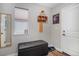 Entryway features a wood-look floor, a black bench, a mirror, and wall accents including a decorative shelf at 6193 Saddle Bow Ave, Parker, CO 80134