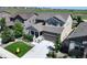 This home boasts professional landscaping, a covered porch, and a two-car garage at 6193 Saddle Bow Ave, Parker, CO 80134