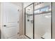 Elegant shower with black trim, white tile, and black accent tiles at 6193 Saddle Bow Ave, Parker, CO 80134