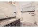 Bathroom featuring a single vanity with granite counters and tub shower combo at 12441 W Virginia Ave, Lakewood, CO 80228