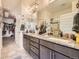 Bathroom featuring double vanity, granite countertops, and tiled floors at 12441 W Virginia Ave, Lakewood, CO 80228