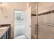 Elegant bathroom with granite counters and glass-enclosed shower with white subway tile at 12441 W Virginia Ave, Lakewood, CO 80228