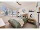 Comfortable bedroom with a ceiling fan and natural light from the window at 12441 W Virginia Ave, Lakewood, CO 80228