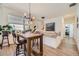 Cozy dining area with modern lighting and a view from a large window at 12441 W Virginia Ave, Lakewood, CO 80228