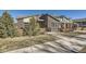 Contemporary home showcasing a brick facade, modern design, and inviting outdoor space at 12441 W Virginia Ave, Lakewood, CO 80228