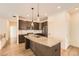 Modern kitchen with stainless steel appliances, granite counters and wooden flooring at 12441 W Virginia Ave, Lakewood, CO 80228