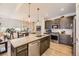 Well-equipped kitchen with stainless steel appliances and granite countertops at 12441 W Virginia Ave, Lakewood, CO 80228