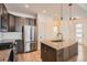 Modern kitchen features stainless steel appliances and granite counters at 12441 W Virginia Ave, Lakewood, CO 80228