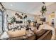 A spacious living room with a fireplace and lots of natural light from the windows at 12441 W Virginia Ave, Lakewood, CO 80228