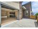 Bright open concept with unique roll-up door, island kitchen, and wood floors at 12441 W Virginia Ave, Lakewood, CO 80228