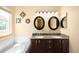 Bathroom featuring double sinks, granite countertops, and vanity at 8879 Apache Plume Dr, Parker, CO 80134