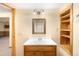 Bathroom with a wood vanity and mirrored medicine cabinet at 8879 Apache Plume Dr, Parker, CO 80134