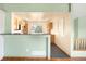 Open kitchen featuring sleek countertops, eat-in bar, tiled floors, and ample cabinet space at 8879 Apache Plume Dr, Parker, CO 80134
