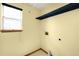 Bright laundry room featuring a window, shelf, and hookups at 8879 Apache Plume Dr, Parker, CO 80134