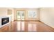 Spacious living room showcasing fireplace and sliding door to the backyard at 8879 Apache Plume Dr, Parker, CO 80134