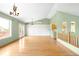 Open-concept living room boasts hardwood floors, access to the deck, and kitchen bar access at 8879 Apache Plume Dr, Parker, CO 80134