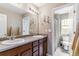 Bathroom with dual sinks, and a shower/tub combination at 23469 E Briarwood Pl, Aurora, CO 80016