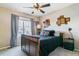 Comfortable bedroom featuring a queen bed, natural light, and minimalist decor at 23469 E Briarwood Pl, Aurora, CO 80016