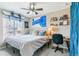 Comfortable bedroom featuring a ceiling fan, a window, and a desk space at 23469 E Briarwood Pl, Aurora, CO 80016