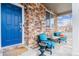 Inviting front porch with comfortable seating and brick detailing, perfect for relaxing outdoors at 23469 E Briarwood Pl, Aurora, CO 80016