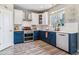Stylish kitchen featuring two-tone cabinets, stainless appliances, and lots of natural light at 23469 E Briarwood Pl, Aurora, CO 80016