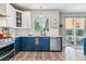 Beautiful kitchen with stainless steel appliances and slider to the backyard patio at 23469 E Briarwood Pl, Aurora, CO 80016