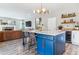 Stylish kitchen island with seating, open to the living room, great for entertaining at 23469 E Briarwood Pl, Aurora, CO 80016