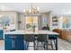 Spacious kitchen island with seating and modern lighting, great for Gathering gatherings at 23469 E Briarwood Pl, Aurora, CO 80016