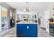 Open concept kitchen island with views to the living room and staircase at 23469 E Briarwood Pl, Aurora, CO 80016