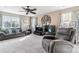 Comfortable living room with ample seating, neutral tones, and natural light at 23469 E Briarwood Pl, Aurora, CO 80016