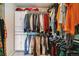 Organized walk-in closet with ample hanging space and built-in storage at 23469 E Briarwood Pl, Aurora, CO 80016