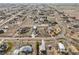 Expansive aerial view showing the property's location within a sprawling residential area at 16665 Kenuil St, Brighton, CO 80603