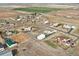 This aerial shows the home sits on a large lot in a sprawling community at 16665 Kenuil St, Brighton, CO 80603
