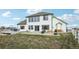 Home back exterior with large windows, big yard and plenty of space for outdoor enjoyment at 16665 Kenuil St, Brighton, CO 80603
