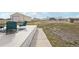 Inviting deck with comfortable seating overlooking the expansive yard at 16665 Kenuil St, Brighton, CO 80603