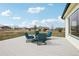 Inviting deck with comfortable seating offers a relaxing outdoor space with views of the expansive yard at 16665 Kenuil St, Brighton, CO 80603
