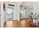 Welcoming entryway featuring hardwood floors, natural light, and views of the yard for a warm first impression at 16665 Kenuil St, Brighton, CO 80603