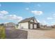 This home features a detached garage, a private entrance, and a beautifully maintained driveway and landscaping at 16665 Kenuil St, Brighton, CO 80603